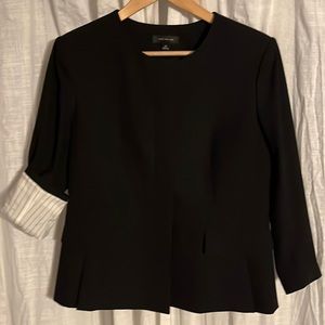 Ann Taylor Black collarless peplum suit jacket. Pinstriped lining in sleeves.